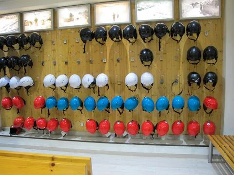 Multi-colored ski or snowboard helmets at the Ski Equipment Rental Office Stock Photos
