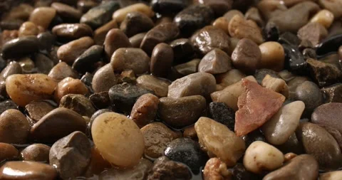 Multi-colored small wet pebbles from the seashore. Stock Footage 249598369