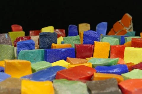 Multi-colored smalt from old Soviet mosaics on black background 写真素材