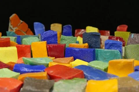 Multi-colored smalt from old Soviet mosaics on black background 写真素材