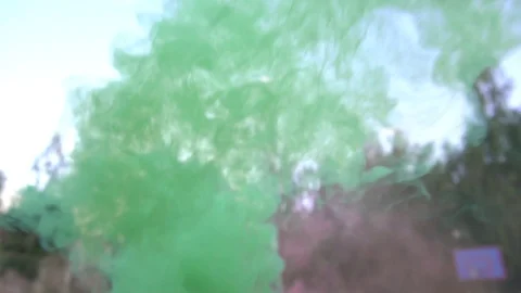 Multi-colored smoke from a rocket launcher against the sky, slow motion Video stock 129933400
