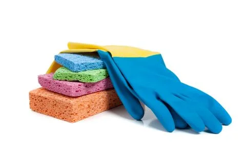 Multi-colored sponges and rubber gloves on a white background Stock Photos