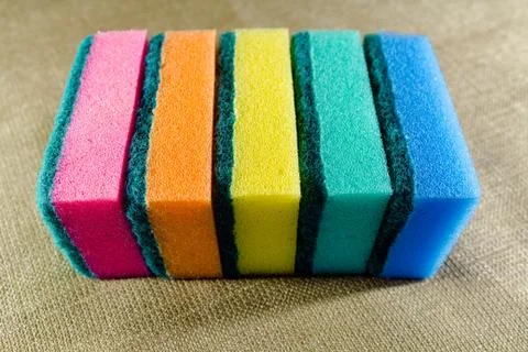 Multi-colored sponges in a row. Microfiber material. For dish washing. Фото
