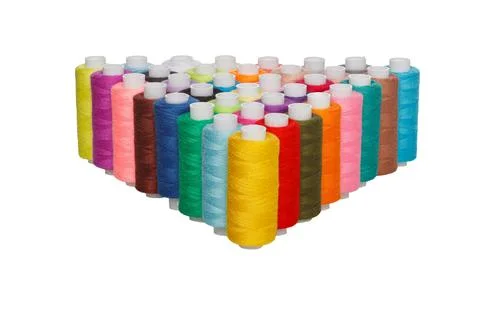 Multi-colored spools of sewing thread on a white background Stock Photos