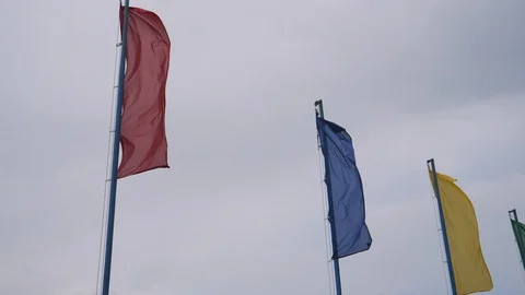 Multi-colored sports flags on the sky background Stock Footage 108395654