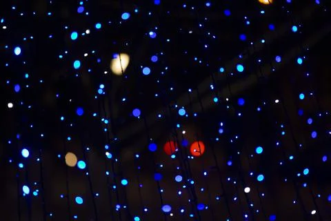Multi-colored spots of lights from Christmas decorations. Stock Photos