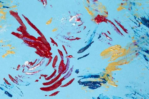 Multi-colored stains of paint on a blue background. Abstract background of go Stock Photos