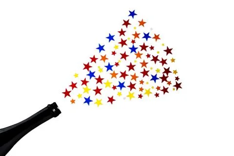 Multi-colored star confetti from a bottle of champagne. Concept for party fou Stock Photos
