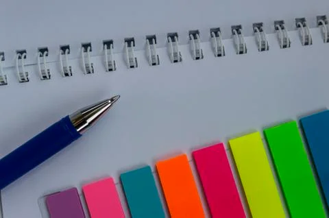 Multi-colored stickers and a notepad with a spiral Stock Photos
