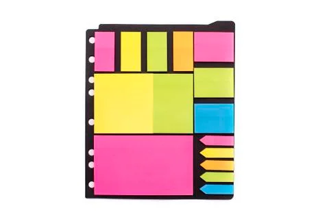 Multi-colored stickers of different sizes and shapes on a black sheet. 스톡 사진