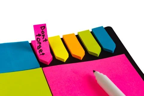 Multi-colored stickers for notes of different sizes and shapes with a marker. Stock Photos