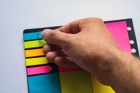 Multi-colored stickers for notes of different sizes and shapes with a marker. Stock Photos