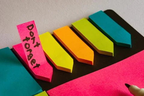 Multi-colored stickers for notes of different sizes and shapes with a marker. Stock Photos