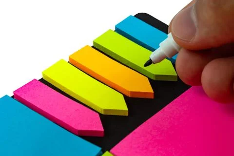 Multi-colored stickers for notes of different sizes and shapes with a marker. Stock Photos