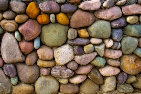 Multi-colored stone wall background Stock Photos