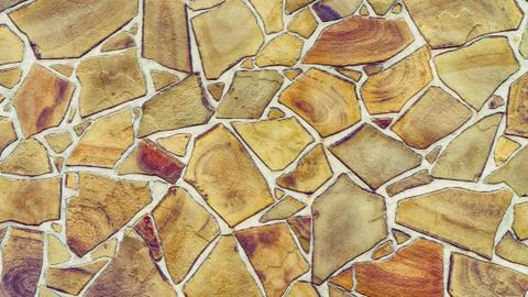 Multi-colored stone wall of modern style design with textured stones bricks o Stock Photos