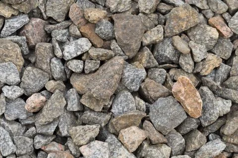Multi-colored stones on the ground. Different shapes and sizes 写真素材