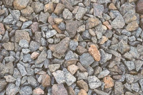 Multi-colored stones on the ground. Different shapes and sizes 스톡 사진