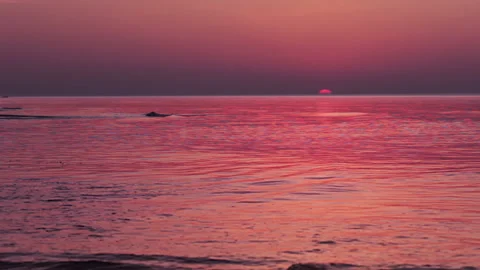 Multi colored sunrise over the surf Stock-Footage 106458316