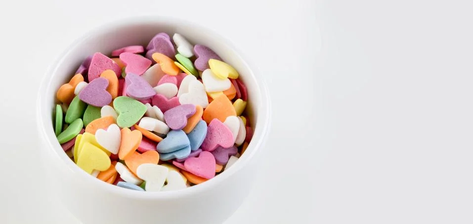 Multi-colored sweets in the form of a heart. Foto stock