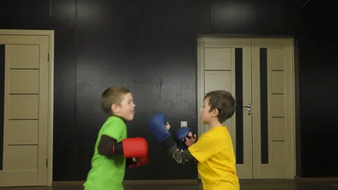 In multi-colored T-shirts, athletes practice pair exercises Stock Footage 148137354