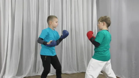 In multi-colored T-shirts, two athletes train paired exercises Stock Footage 150124559