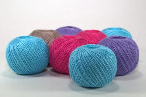 Multi-colored tangles for needlework from natural cotton on a white background Stock Photos