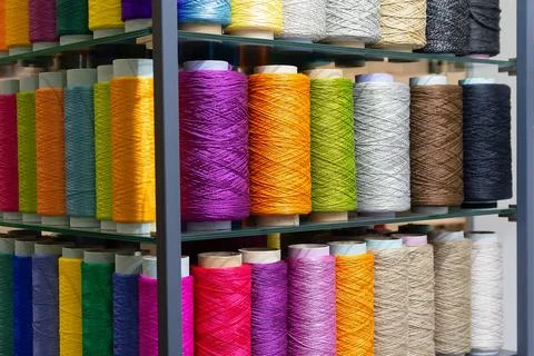 Multi-colored threads at the exhibition stand Stock Photos