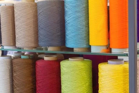 Multi-colored threads at the exhibition stand Stock Photos