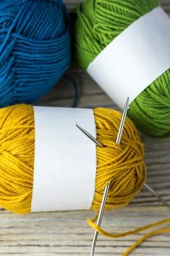 Multi-colored threads for knitting and knitting needles. Selection of colorful Stock Photos