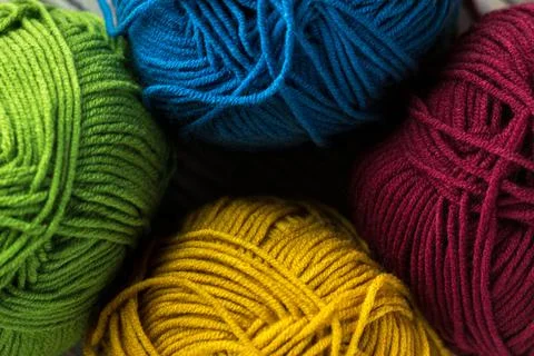 Multi-colored threads for knitting and knitting needles. Selection of colorful Stock Photos