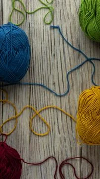 Multi-colored threads for knitting and knitting needles. Selection of colorful Stock Photos