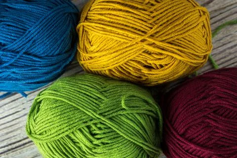 Multi-colored threads for knitting and knitting needles. Selection of colorful Stock Photos