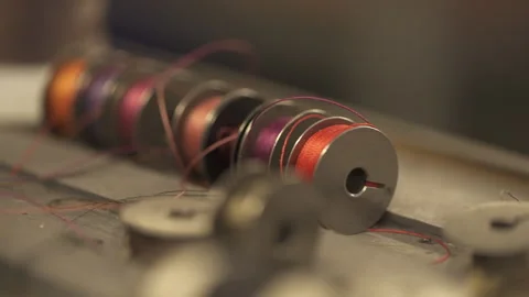 Multi-colored threads in spools for a sewing machine Stock Footage 266140513