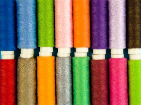 Multi-colored threads in spools, sewing Stock Photos