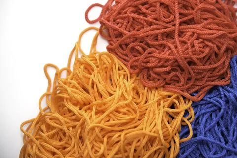 Multi-colored threads on a white background close-up Stock Photos