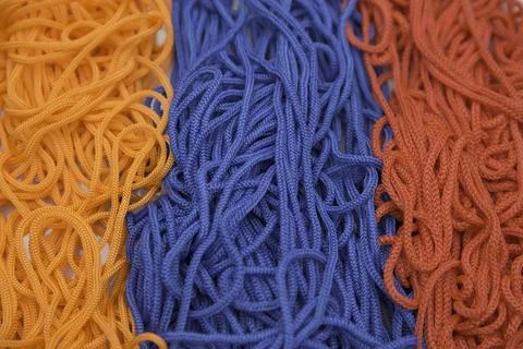 Multi-colored threads on a white background close-up Stock Photos