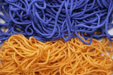 Multi-colored threads on a white background close-up Stock Photos