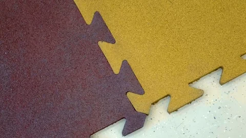 Multi-colored tiles made from rubber crumb from recycled tires Video stock 330890379