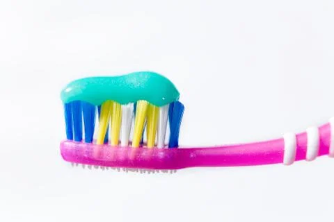Multi-colored toothbrush on a white background. Stock Photos