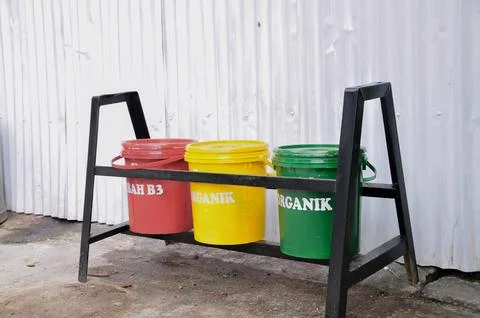Multi-colored trash cans for separating types of waste Stock Photos