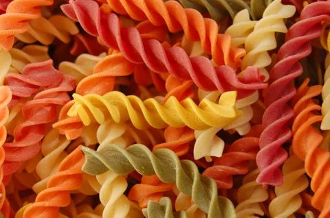 Multi colored twirls pasta background Stock-Fotos
