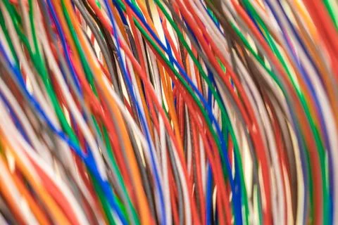 Multi-colored vertical electrical wires. Telecommunication communication wire 库存照片