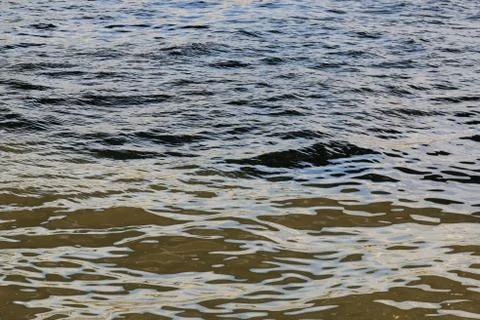 Multi-colored waves of one river Stock Photos