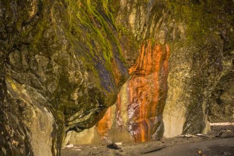 Multi colored wet rock wall Stock Photos