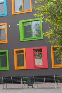 Multi-colored windows of the school in a contemporary style. Architecture Stock Photos