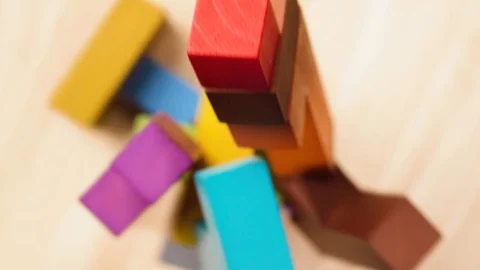 Multi-colored wooden blocks are assembled in a high tower. Video stock 105746016