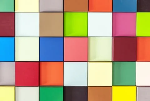 Multi-colored wooden cubes with 3D effect. Background from colored squares. Stock Photos
