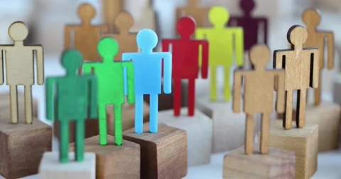 Multi-colored wooden figurines in crowd closeup Stock Footage 280838913