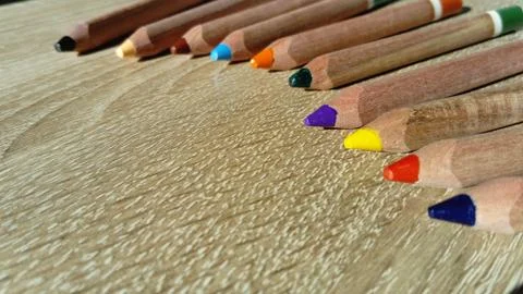Multi-colored wooden pencils of a triangular shape in a section are intended  Fotos de archivo